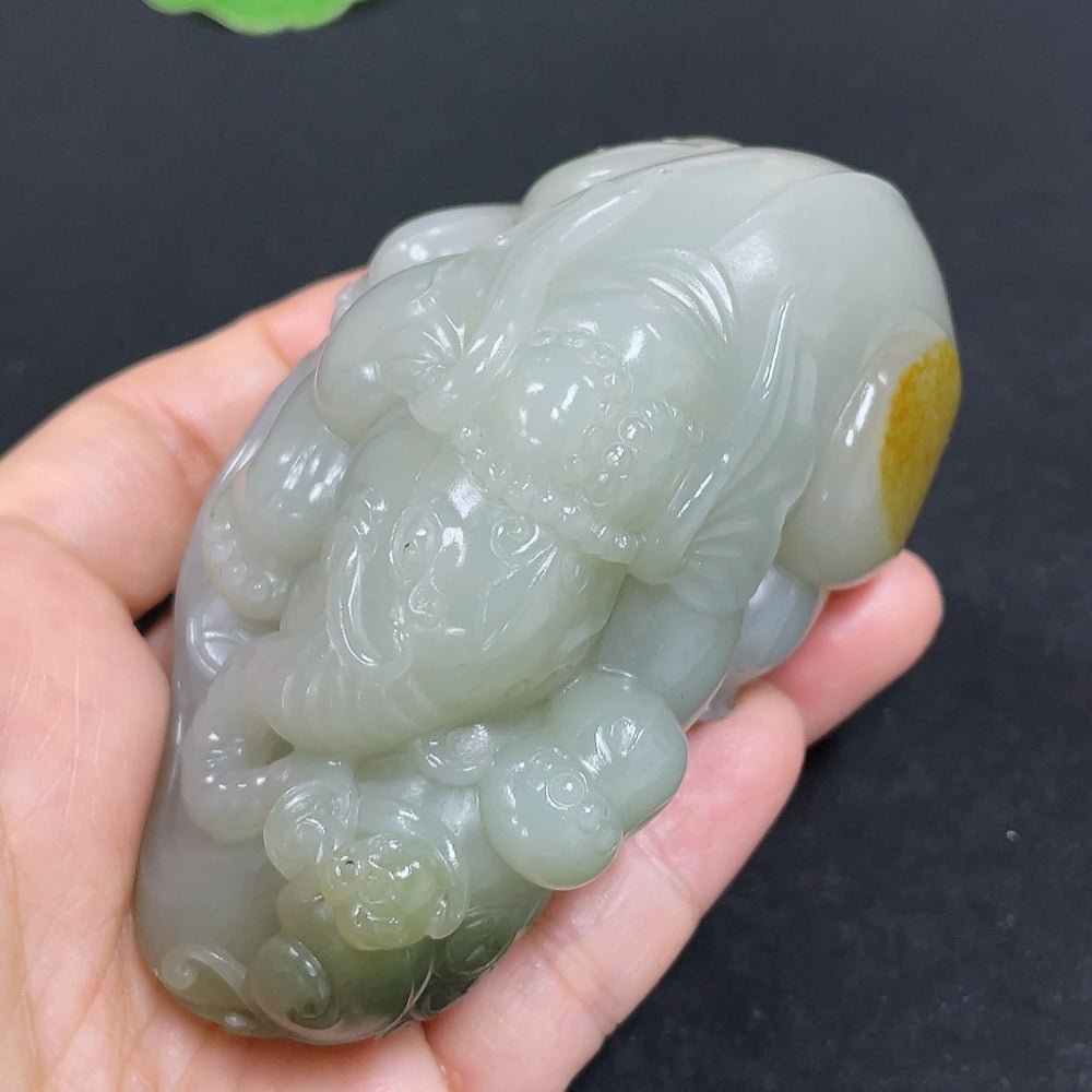 Hong Kong Jade HKHQ Hetian Jade Seed Hand Piece featuring intricate design and smooth jade material for elegant jewelry.