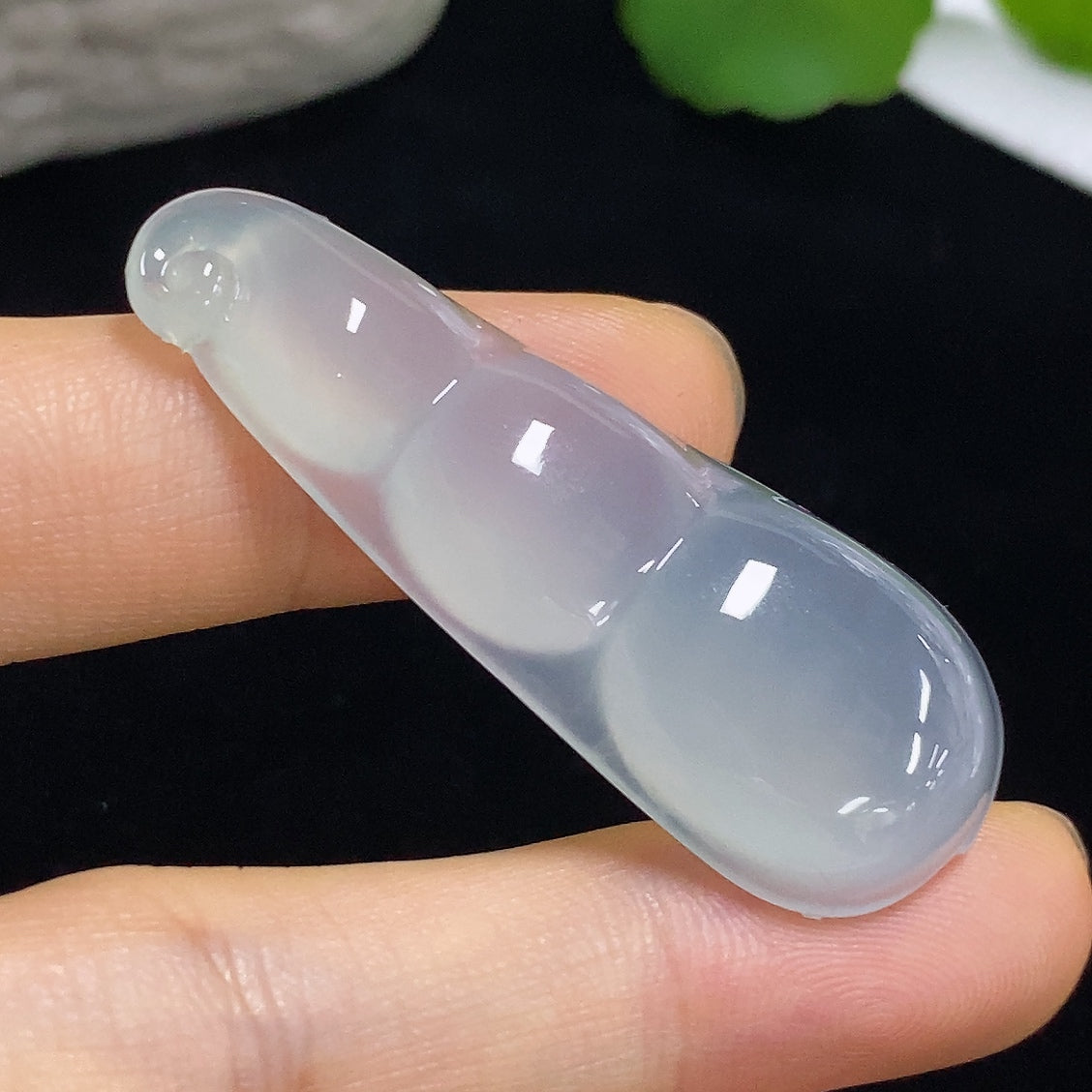 Jadeite pendant with Fu Dou design, approximately 9.8g, crafted from high-quality jade by HKHQ, showcasing intricate details.