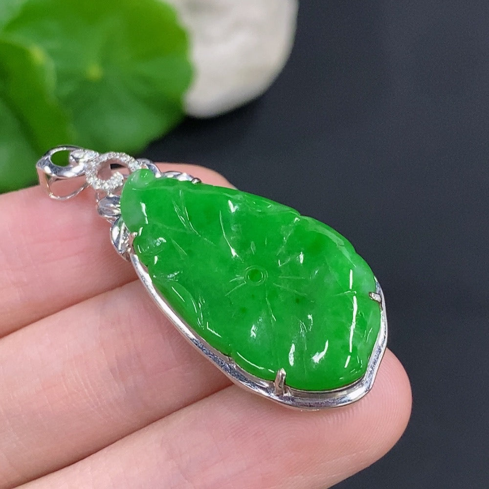 Jadeite lotus leaf pendant with 18K gold accents and diamond details, crafted by HKHQ, weighs approximately 4 grams.