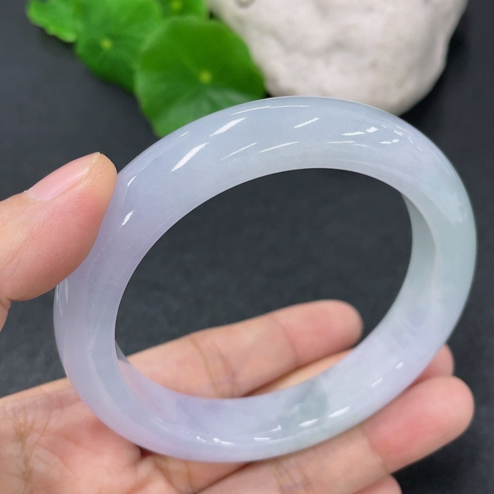Jadeite round bangle bracelet in size 56.5, weighing 63.79g, from HKHQ, featuring smooth, polished jadeite surface.