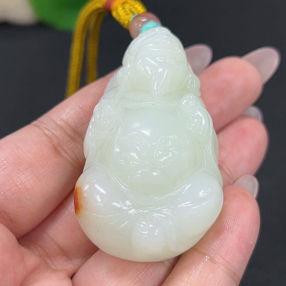 Hetian jade pendant featuring the God of Wealth, carved from green jade with a rope attachment, weighing approximately 64.7g.