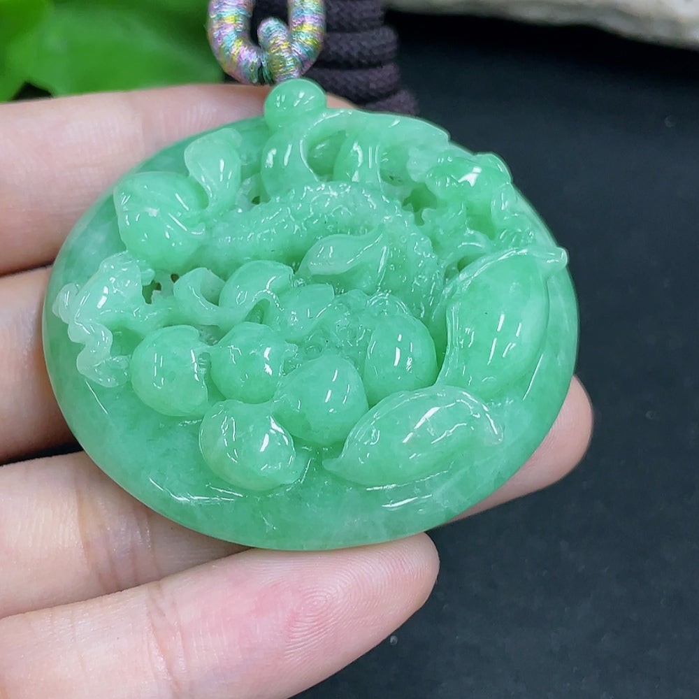 HKHQ jadeite lotus pendant necklace with a rope, weighing approximately 48.61 grams, featuring a detailed lotus design.