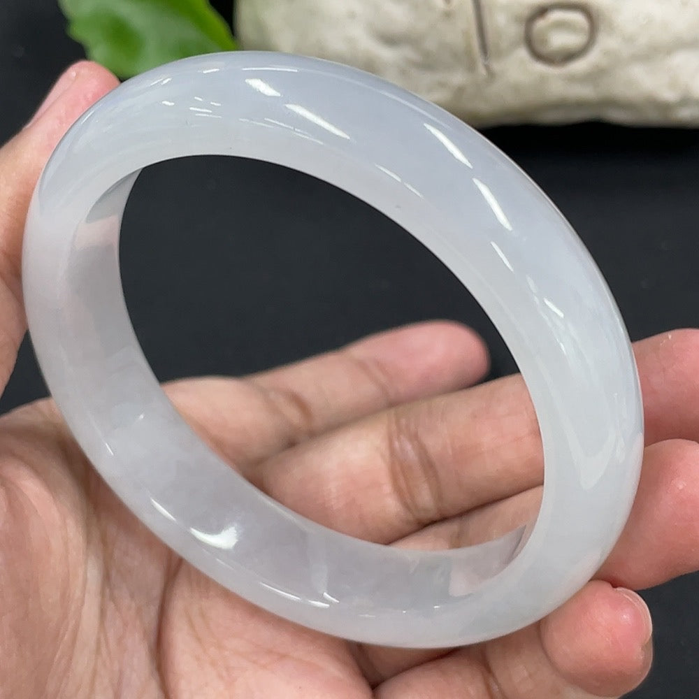 HKHQ jadeite round bangle with 57.5mm diameter, weighing approximately 58.27g, showcasing smooth, polished green jadeite surface.