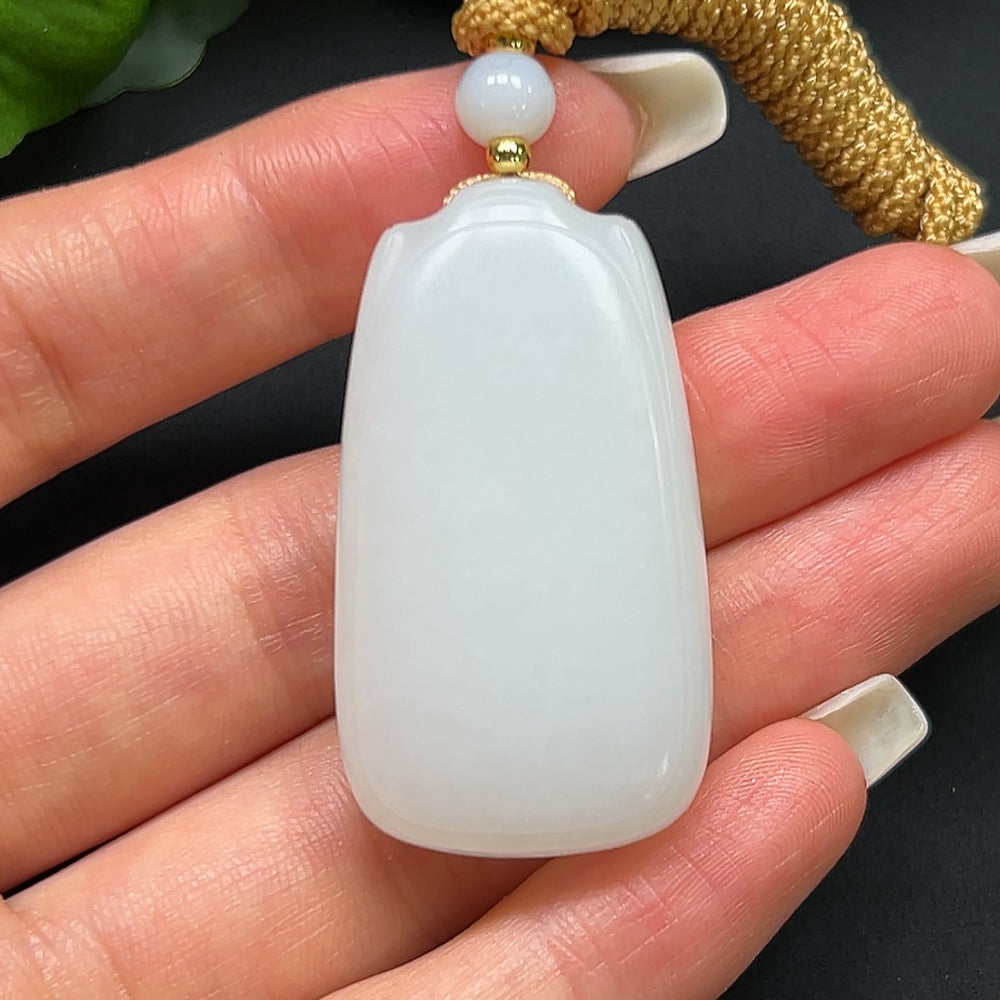 HKHQ Hetian Jade plain pendant with rope, weighing approximately 27.31g, featuring smooth, polished jade stone.