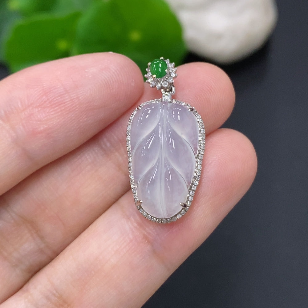 Jadeite leaf pendant with 18K gold and diamond accents, weighing approximately 2.5g, featuring intricate leaf inlay design.