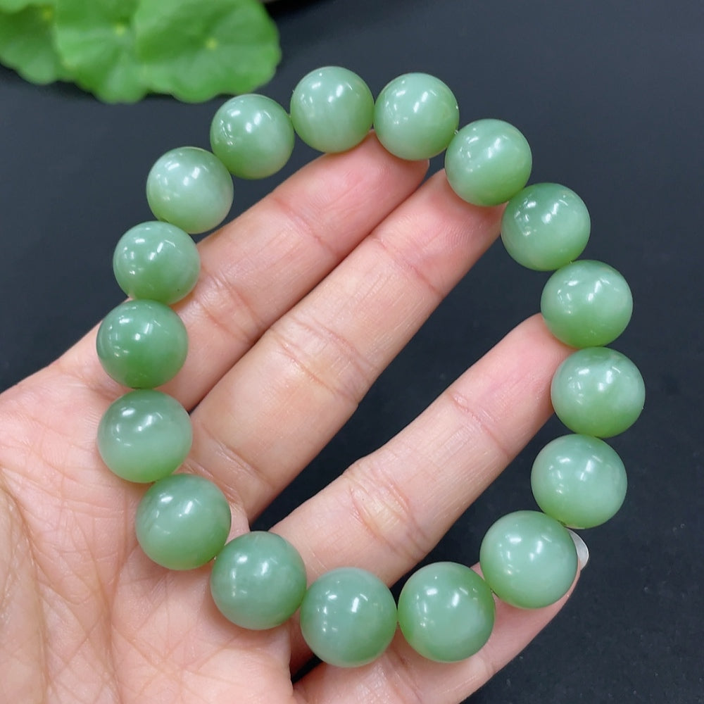 HKHQ Hetian Jade Jasper bracelet with 11.7mm beads, showcasing smooth, polished jade stones in a stylish jewelry piece.
