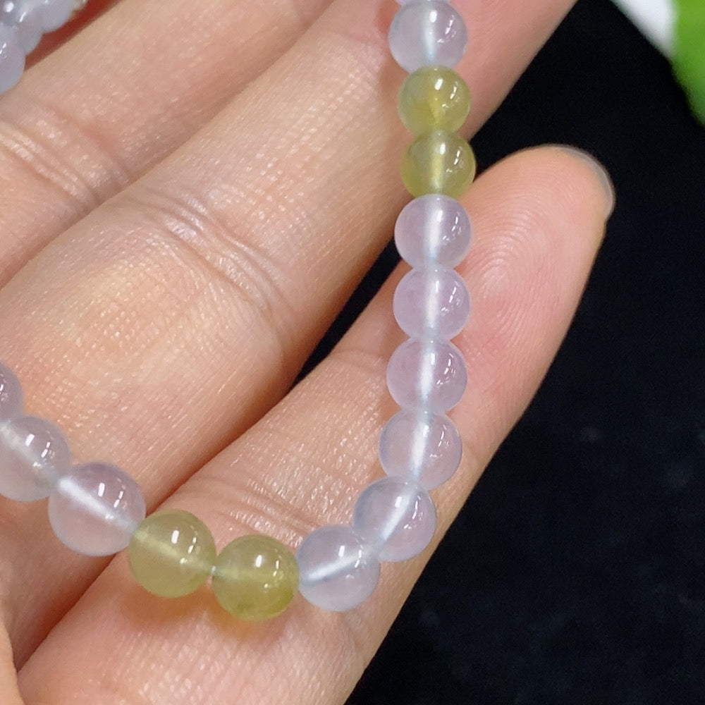 Jadeite bracelet with 4.8mm beads, non-gold, weighing approximately 8.22g, featuring smooth green jade stones on a jewelry strand