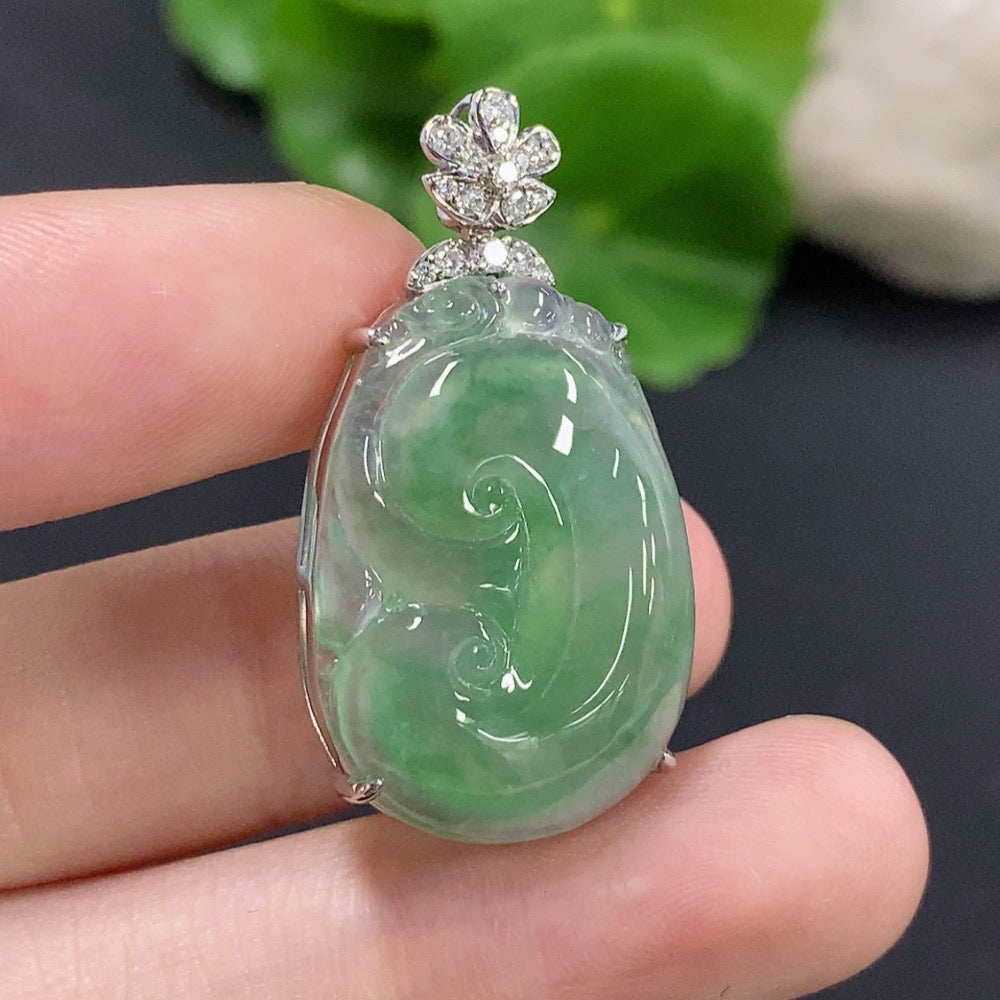 Jadeite Ruyi pendant with 18K gold and diamond accents, showing intricate inlay work and a smooth polished jade surface.