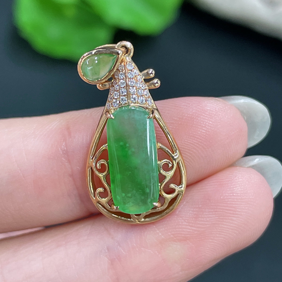Jadeite pendant with 18k gold inlay and diamond accents, HKHQ jewelry, showcasing the intricate design and polished surface.