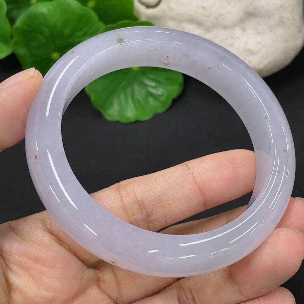 Huiliu Jadeite round bracelet showcasing smooth, polished jade beads with a natural green hue and silver clasp.