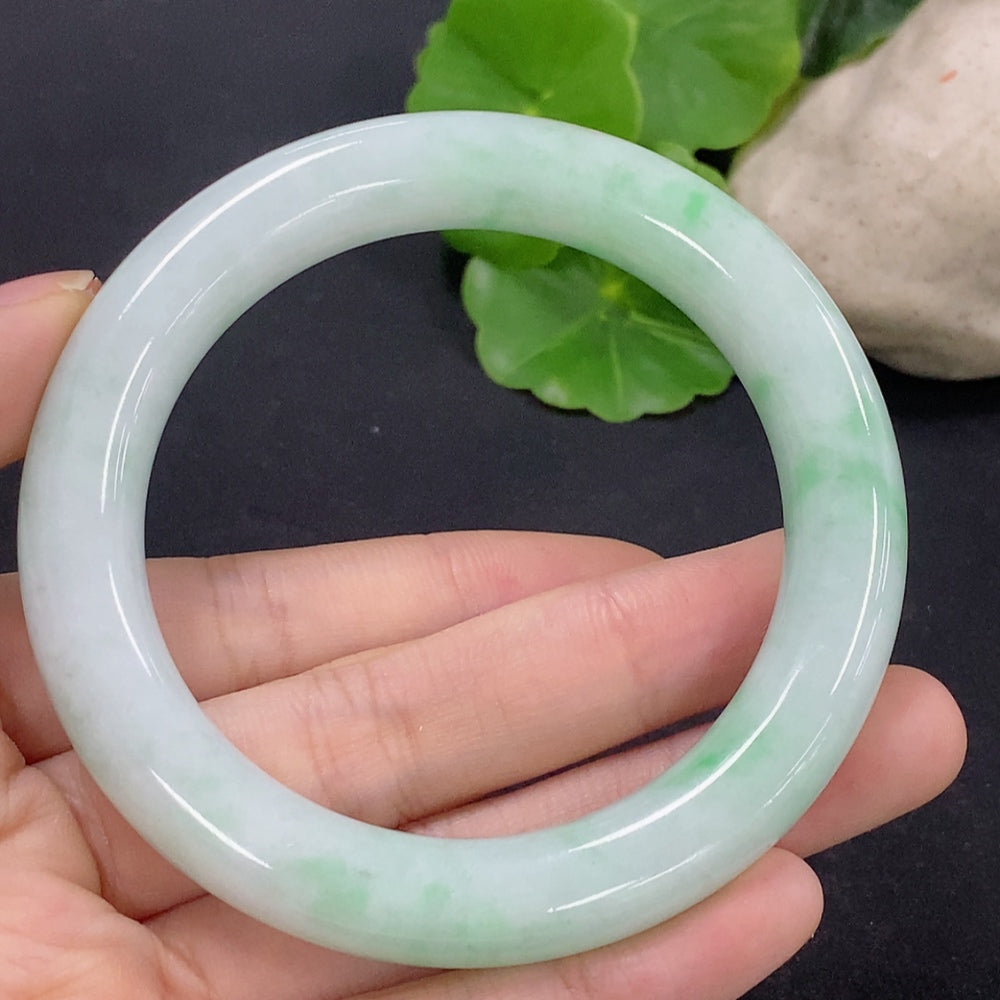 HKHQ jadeite round bangle size 56, 62.4g, showcasing smooth polished jadeite with a glossy finish and rounded shape.