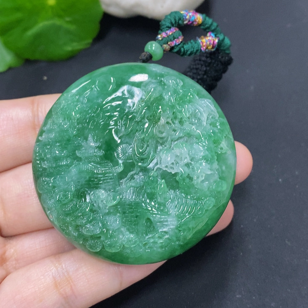HKHQ jadeite landscape pendant necklace with cord, approximately 66.1g, showcasing a detailed jadeite design on a cord necklace.