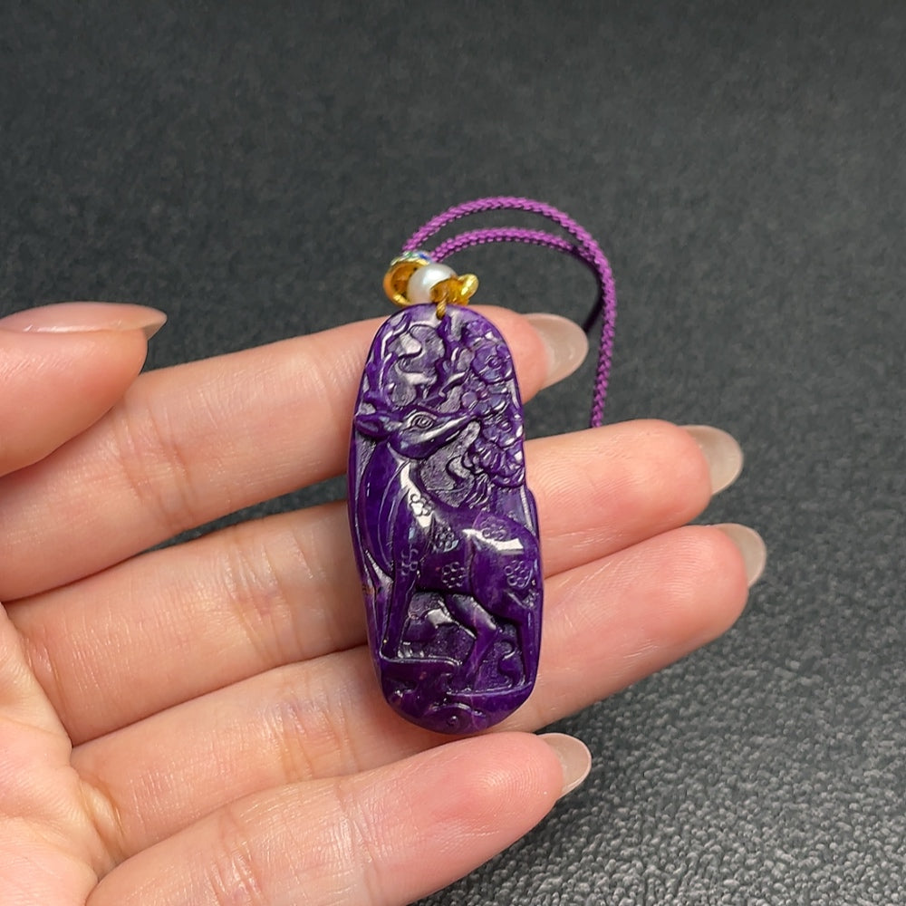 Sugilite pendant with other mineral components, total weight approximately 11.73g including rope, non-gold