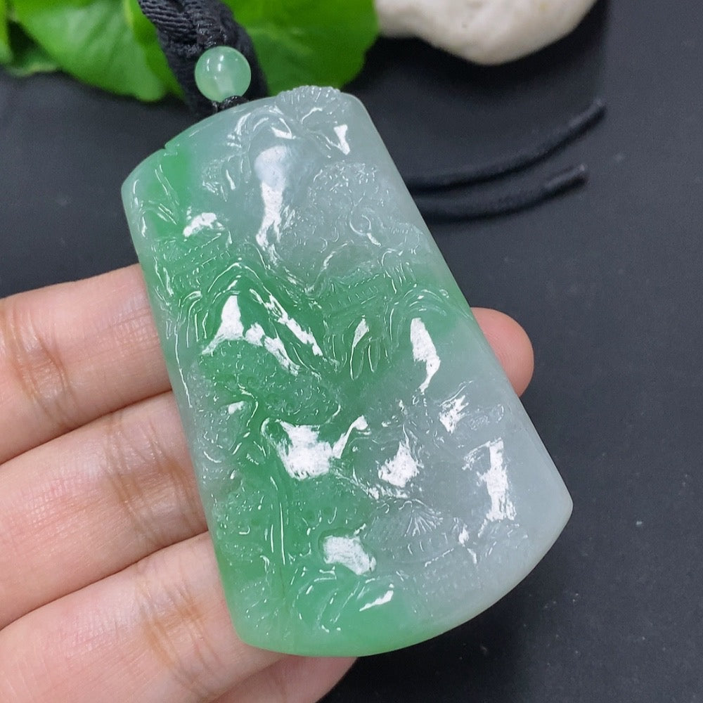 Jadeite pendant with landscape plaque, approx. 36.4g, featuring a jade gemstone and cord for wearing, by HKHQ.