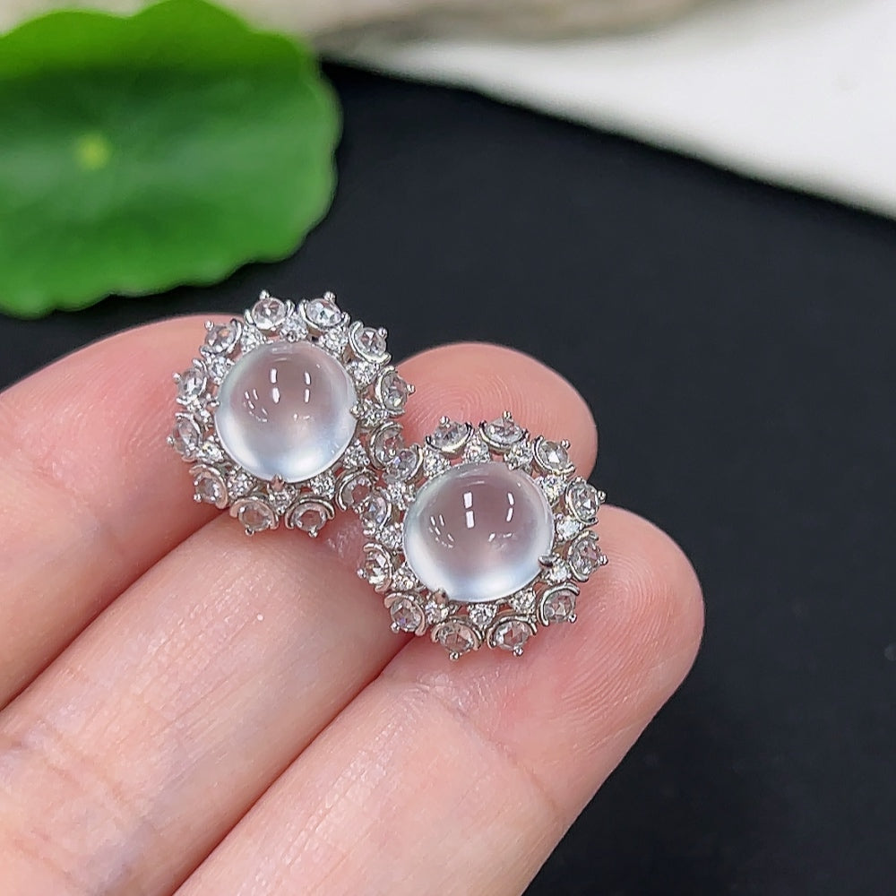 Unmarked jadeite earrings with 18k gold and diamond accents, weighing approximately 4.9g, featuring elegant jade stones.