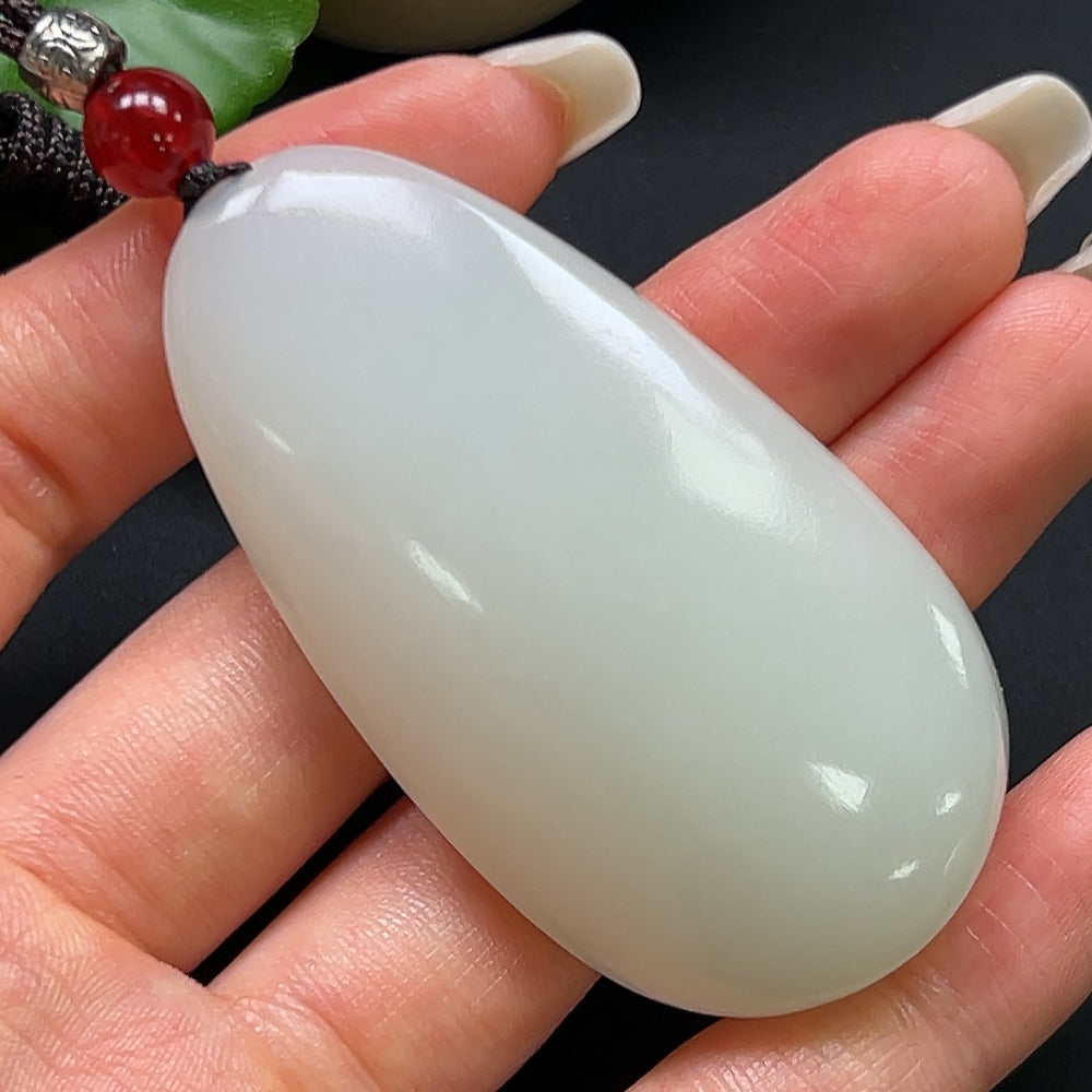 Hetian Jade plain pendant necklace with rope chain by HKHQ, showcasing a smooth, polished jade pendant weighing 43.84g.