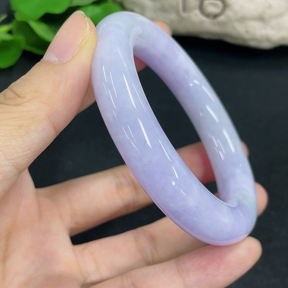 HKHQ jadeite round bangle size 52.4 with a total weight of 75.76g, showcasing smooth, polished jadeite surface and elegant design.