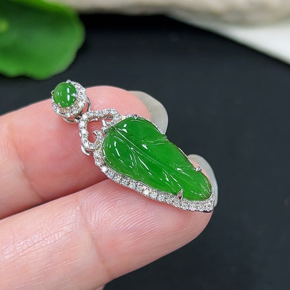Jadeite leaf pendant with diamond accents in 18K gold, weight approx. 3g, featuring natural jade gemstone and intricate leaf design.