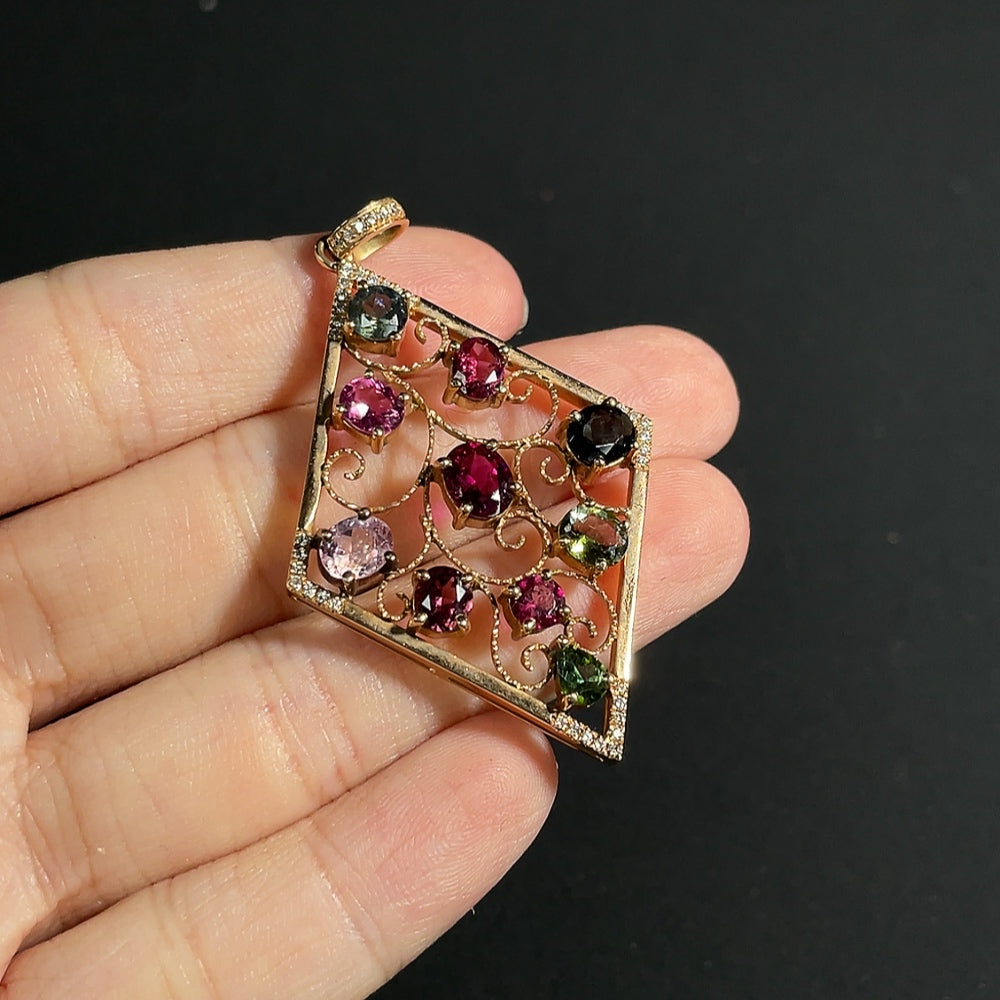 Tourmaline pendant with spinel (light purple, gray blue) and diamond accents, 18k gold