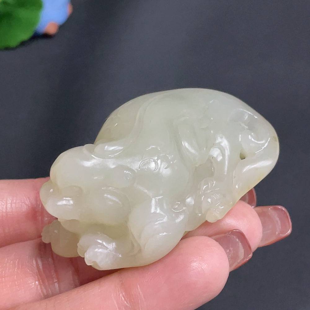 Huiliu Hetian jade pendant featuring an auspicious beast design, with undetermined skin color, crafted from high-quality jade.