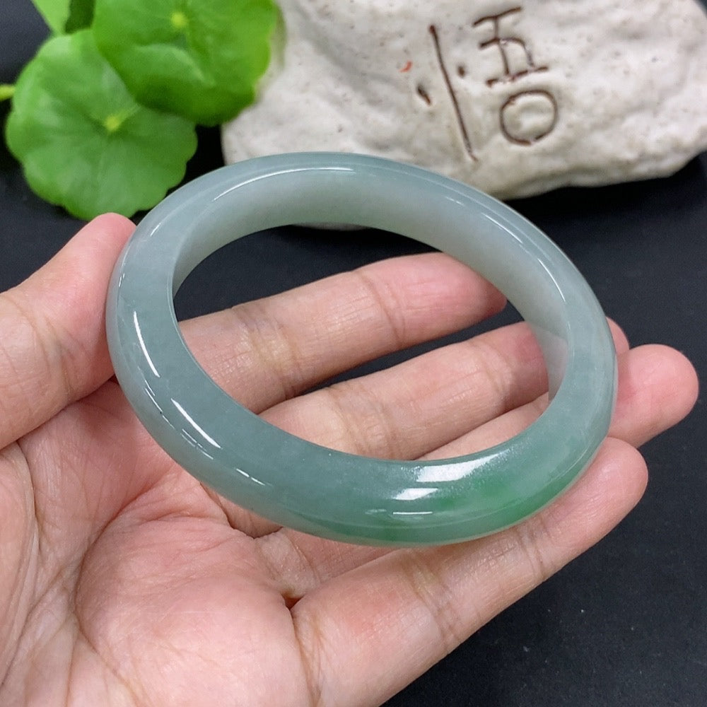 HKHQ jadeite round bangle, size 55.5, 53.26g, showcasing smooth, polished jadeite bracelet with natural green hue and rounded design.