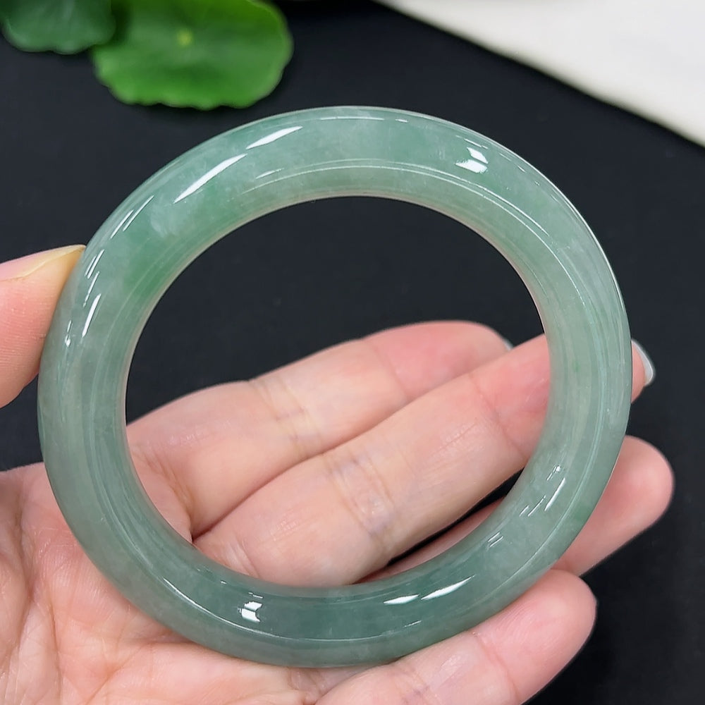 Jadeite round bangle in size 54.3 with a total weight of 58.4g, featuring smooth polished surface and vibrant green color.