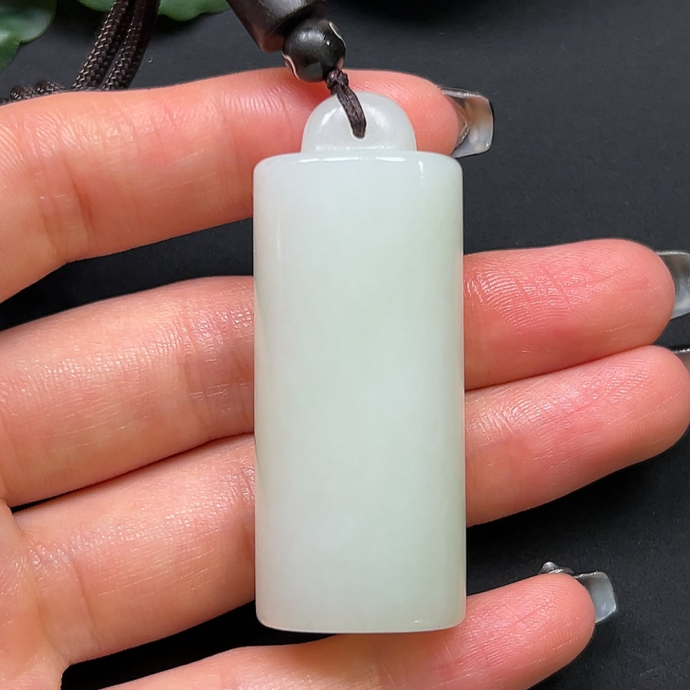 Hetian Jade bamboo tube pendant necklace with rope, crafted by HKHQ, weighing approximately 38.6g, showcasing smooth jade and elegant design.