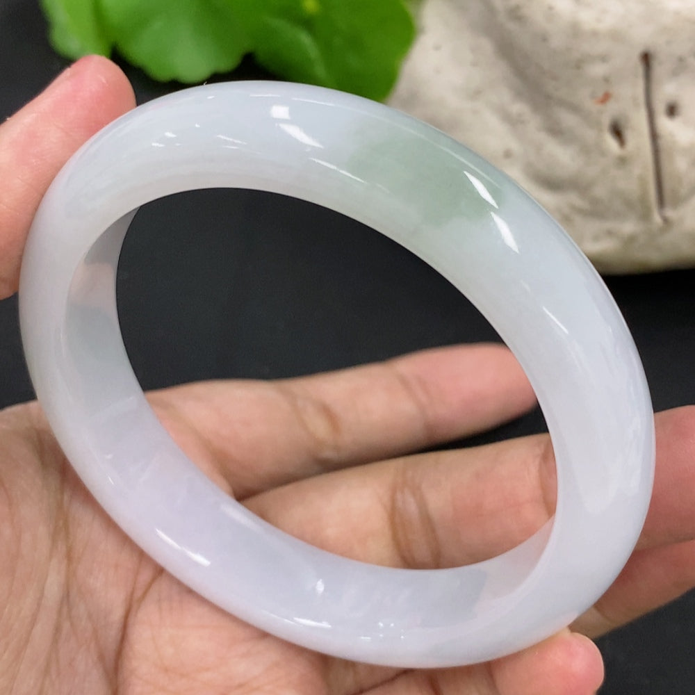 Jadeite round bracelet in green jade, weighing about 53.57g, size 55.7mm, from HKHQ with smooth polished surface.