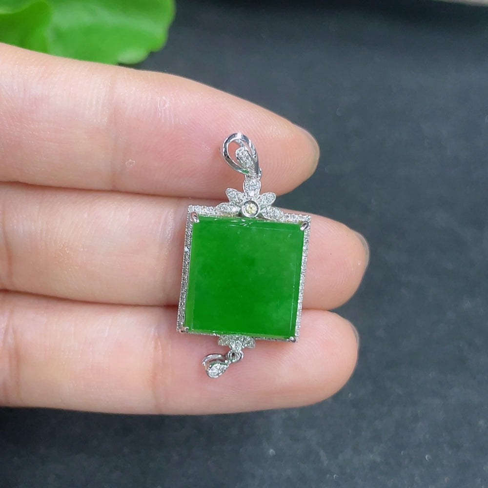 Jadeite pendant with 18k gold and diamond accents, featuring a polished green jade stone on a necklace chain.