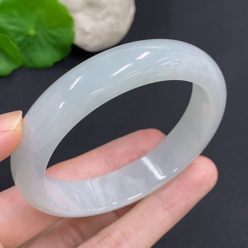 Jadeite round bangle with a total weight of 52.7g and size 55.7, featuring smooth, polished green jadeite from HKHQ.