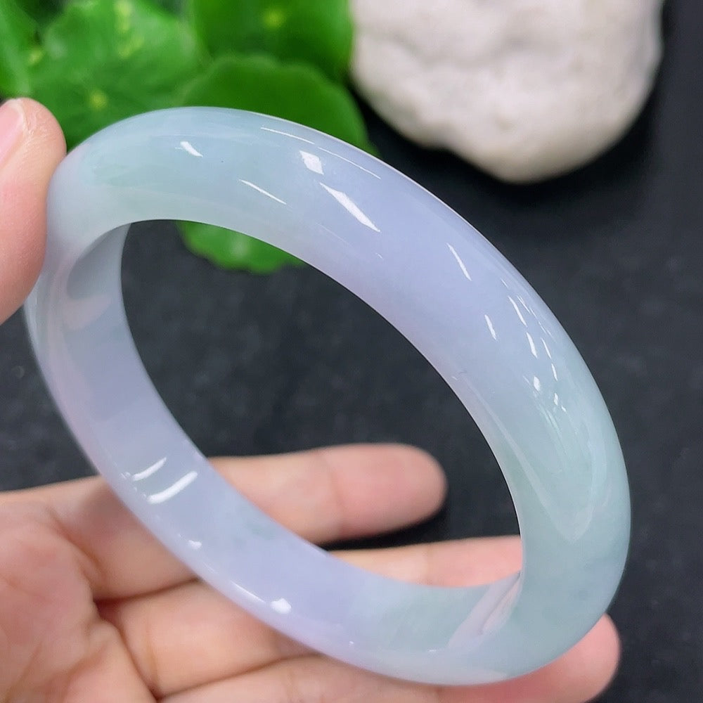 HKHQ jadeite round bangle weighing about 55g and size 57.9, showcasing smooth, polished green jade with intricate craftsmanship.