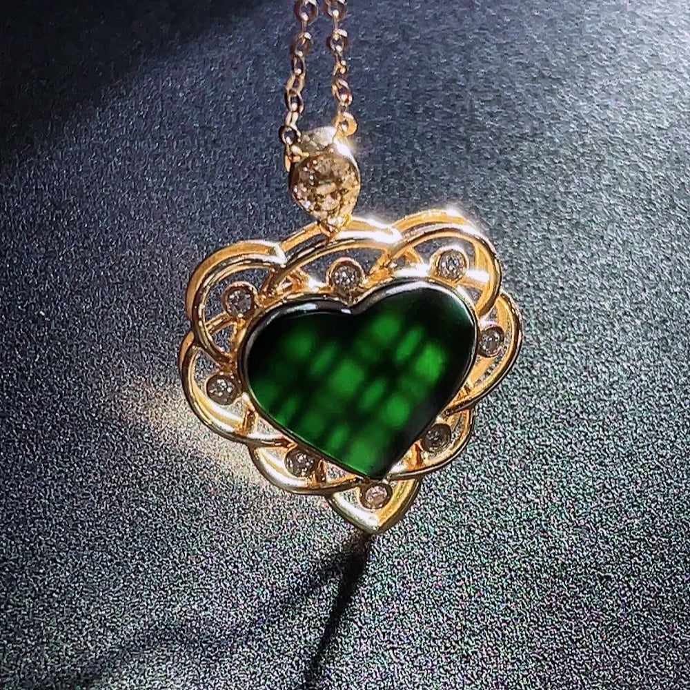 Jadeite heart-shaped pendant with 18k gold and diamond accents