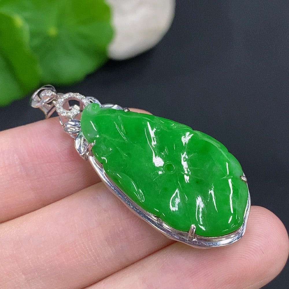 Jadeite lotus leaf pendant with 18K gold accents and diamonds, crafted by HKHQ, showing intricate leaf design and sparkling details.