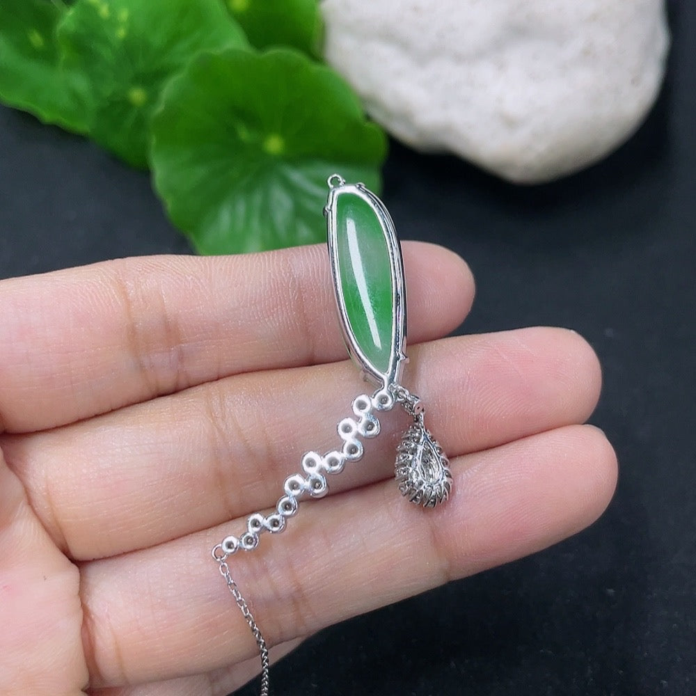 Jadeite pendant with 18K gold and diamond accents on a delicate chain, showcasing elegant jewelry design.