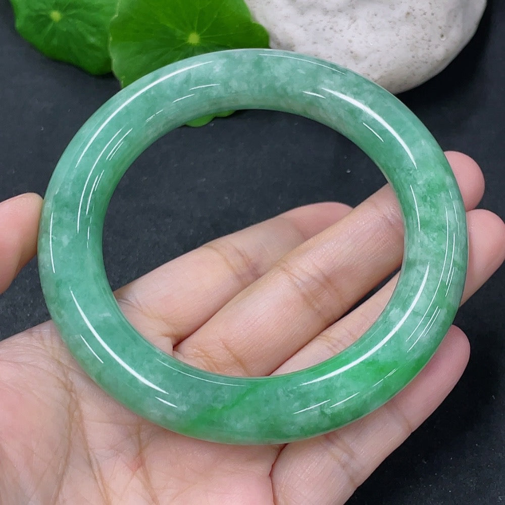 Jadeite round bangle with 55.5mm diameter, crafted from green jade, weight approximately 77g, by HKHQ.