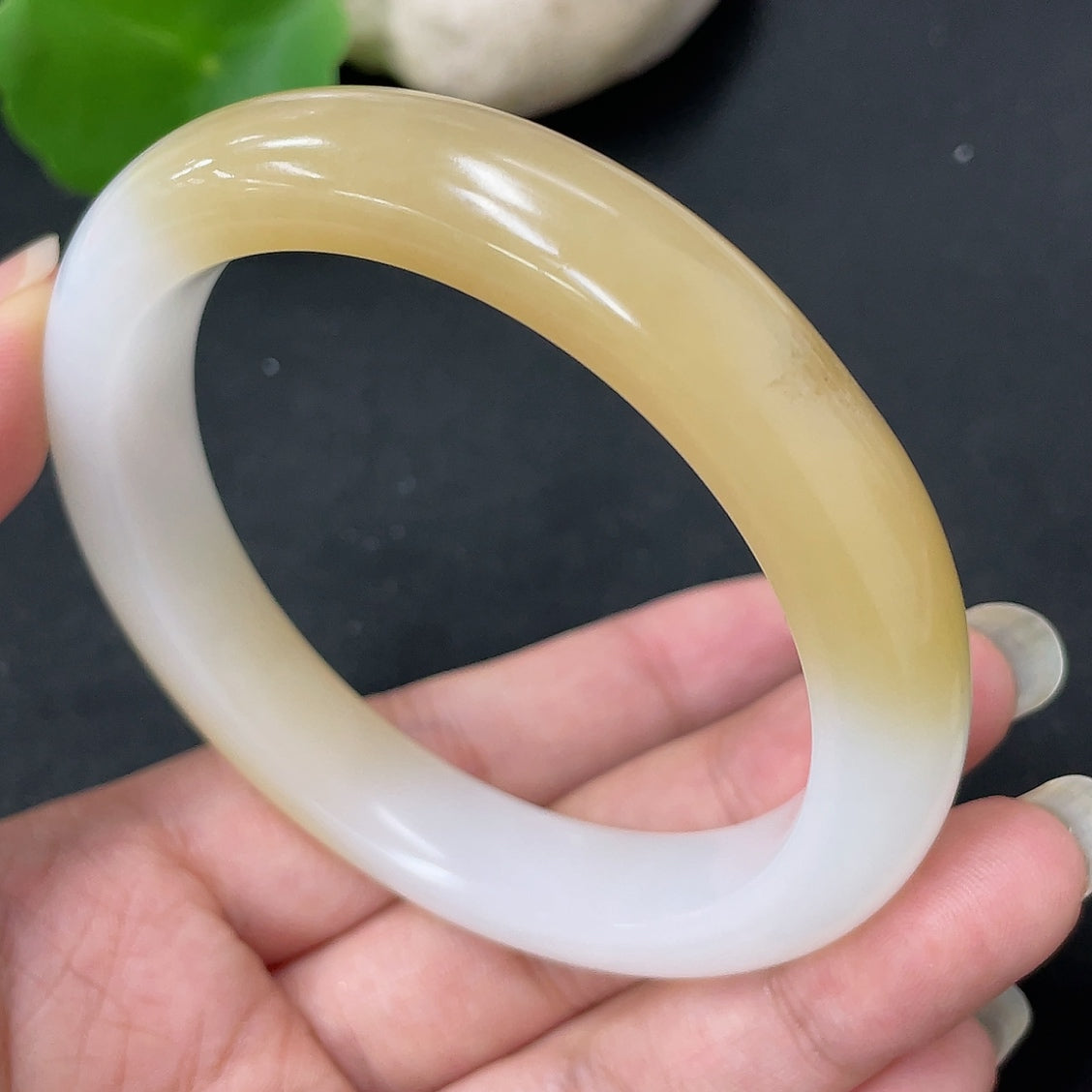 HKHQ Hetian jade round bracelet, size 57.3, with approximately 52.5g weight, featuring smooth, polished jade beads.