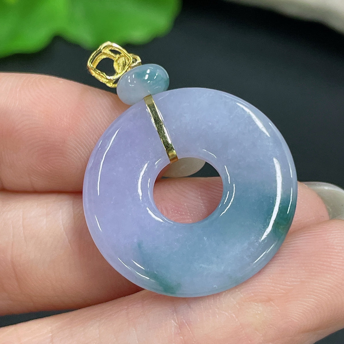 Jadeite pendant with 18k clasp from HKHQ, showcasing smooth green jade stone and gold clasp, total weight around 4.5 grams.