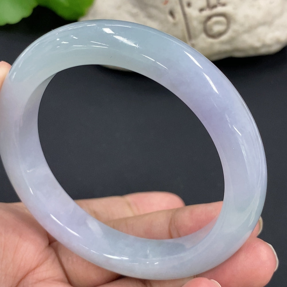HKHQ jadeite round bangle bracelet with 67.3g weight and size 58.7, showcasing smooth, polished jadeite surface.