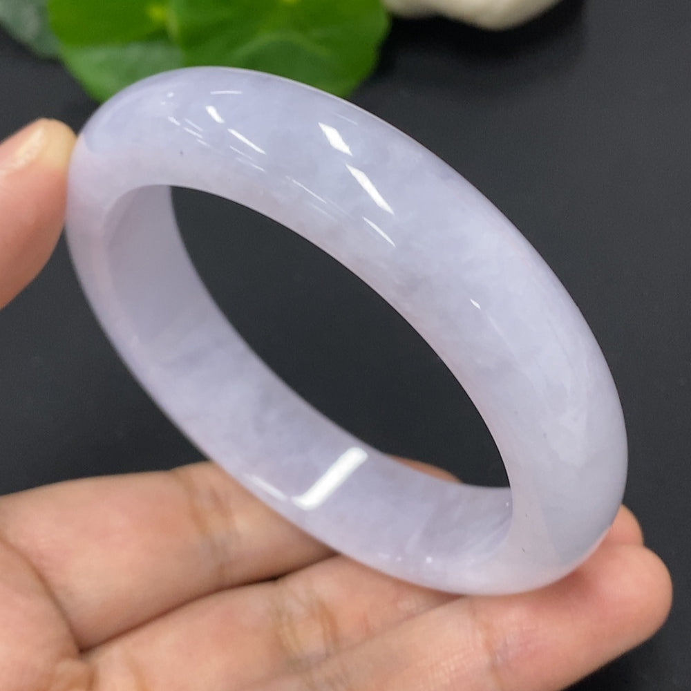 HKHQ jadeite round bangle in size 56.6 with a total weight of 67.5g, showcasing smooth, polished jadeite surface.