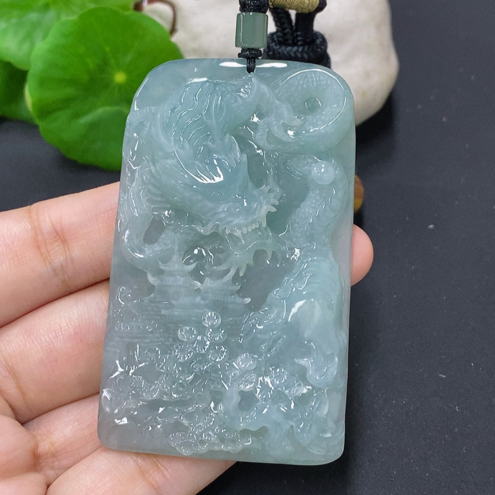Jadeite dragon pendant with intricate design, hanging from a rope, weighs approximately 68.4g, crafted by HKHQ.