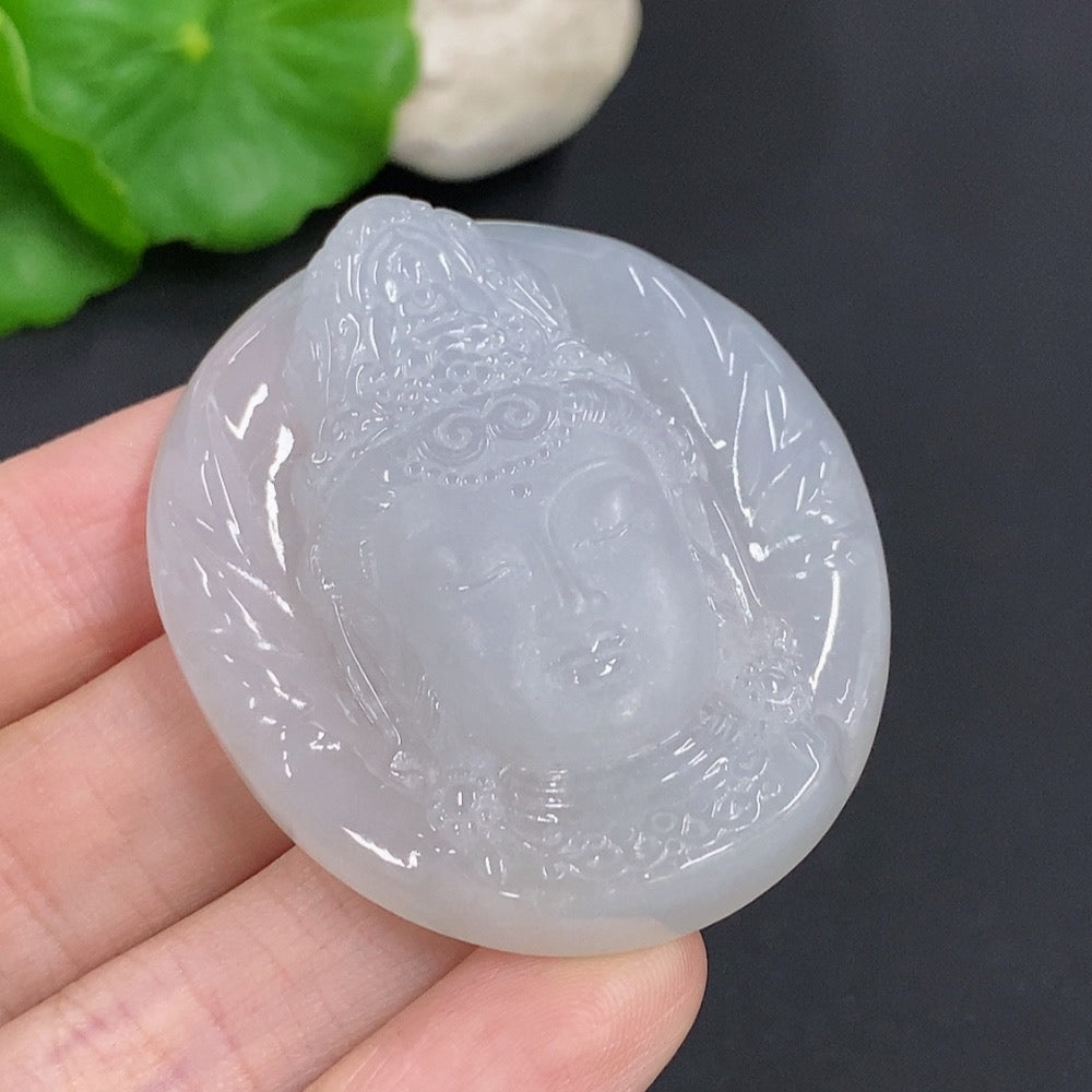 Jadeite Guanyin pendant necklace from HKHQ, featuring a detailed carved figure, weighs approximately 38g, on a silk cord.