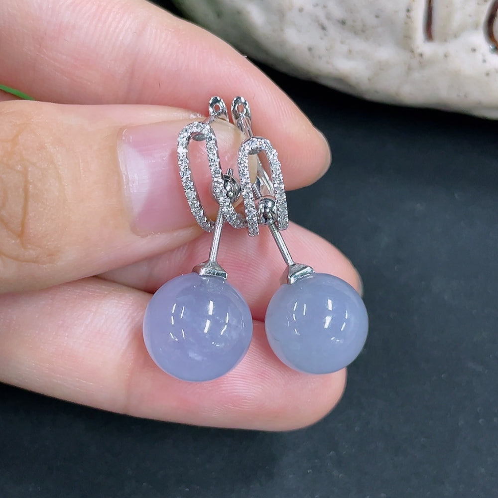 Jadeite earrings with 18k gold and diamond accents, featuring green jade stones and intricate gold settings.