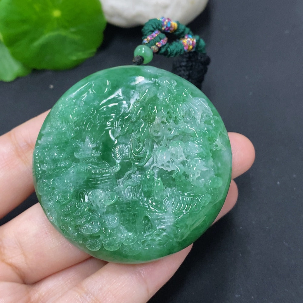 Jadeite landscape pendant on cord necklace by HKHQ, approximately 66.1g, featuring a detailed green jade design.