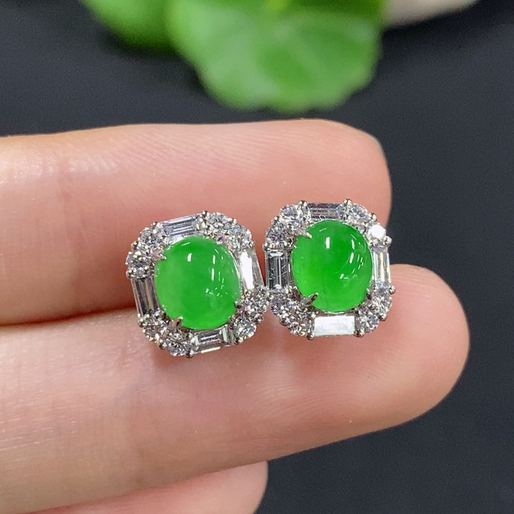 Pair of Jadeite earrings with 18K gold, slim stud design, HKHQ brand, weighing approximately 1.9g including ear stoppers.