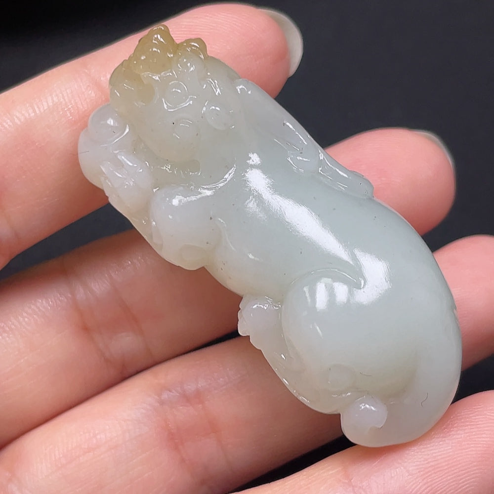 Hetian jade Pixiu pendant with detailed carving, weighing approximately 73.49g, crafted by HKHQ, showcasing traditional jade artistry.