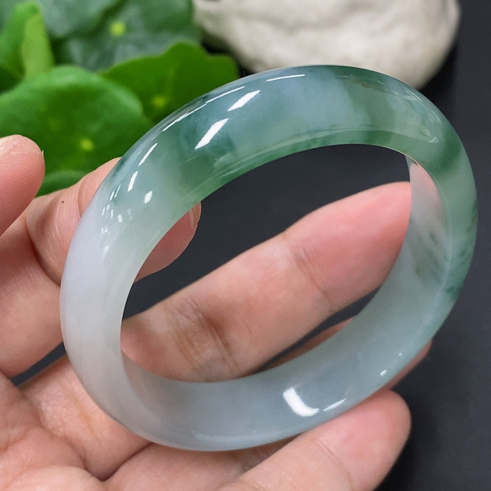 Jadeite Concubine bracelet with gold accents, size 55.3/47.6, weighing approx. 38.1g, featuring smooth jadeite stones and intricate design