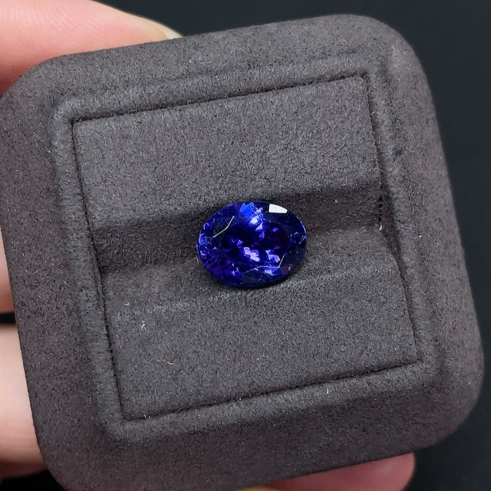 Loose tanzanite gemstone weighing approximately 4.82 carats, vibrant blue-purple color, from HKHQ gemstones collection.