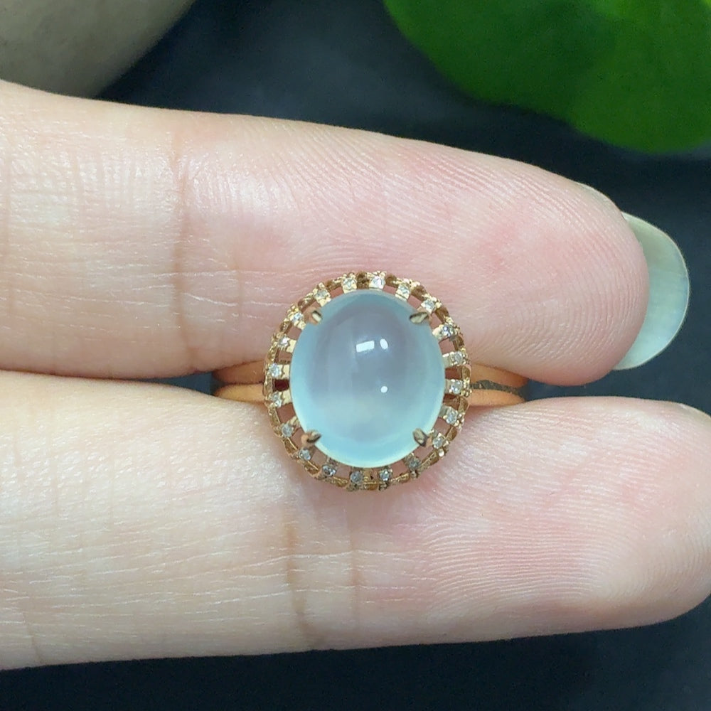 Jadeite bezel-set cabochon ring with diamond accents in 18k gold, size 14, showcasing the smooth jade gemstone and elegant design.