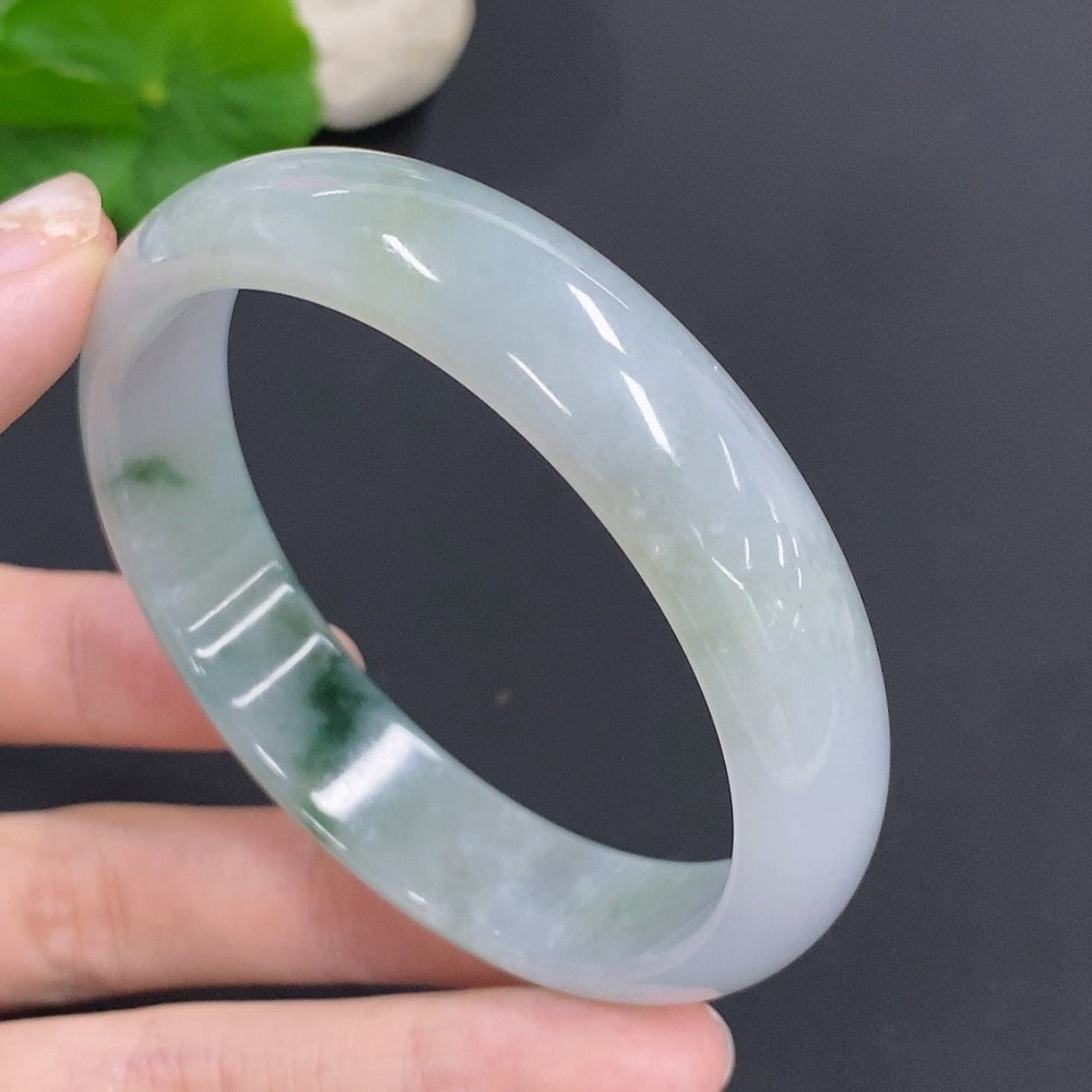 Jadeite round bangle in green jade, weighing approximately 48.4g, size 58, from HKHQ, with smooth polished surface.