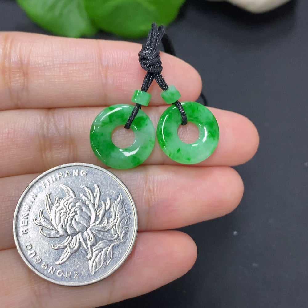 Set of jadeite donut pendants for necklaces, totaling approximately 2.3 grams, featuring smooth green jadeite gemstone designs.